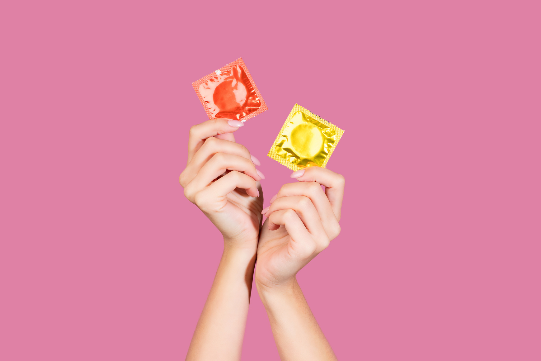 Woman holding condom