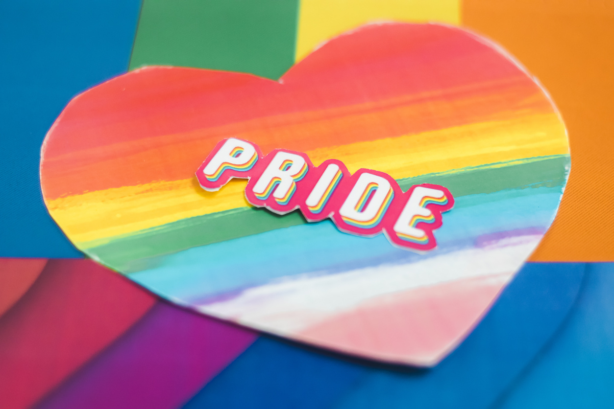 Pride Stickers on Rainbow Background